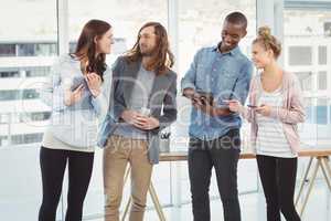 Business team using technology at creative office