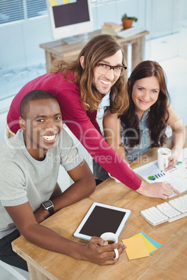 High angle portrait of business people at desk