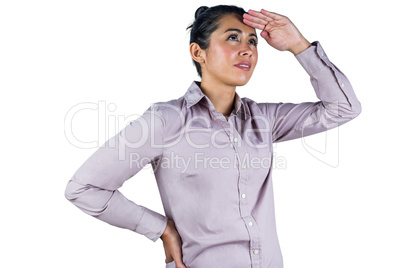Businesswoman looking upwards with hands on head