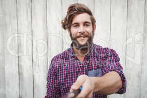 Portrait of hipster using selfie stick