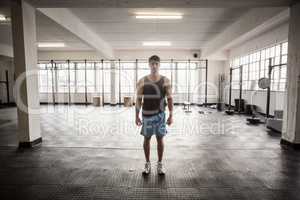 Young Bodybuilder posing in front of the camera