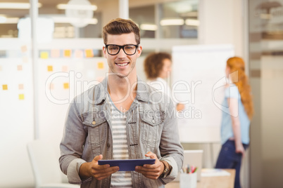 Businessman holding digital PC