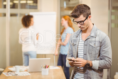 Businessman texting on phone