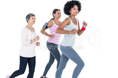 Determined female friends jogging