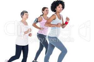 Determined female friends jogging