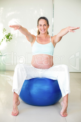 Portrait of woman sitting on ball