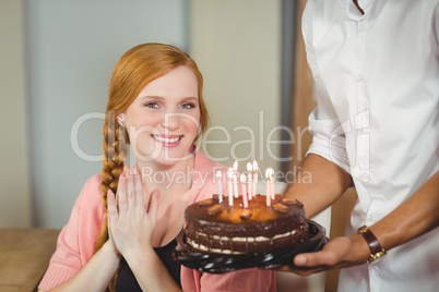 Happy Woman by birthday cake
