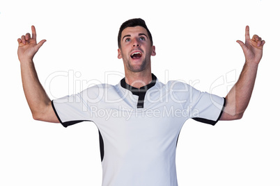 Surprised rugby player pointing up