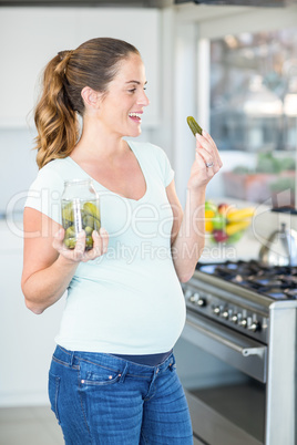 Happy woman with pickle in hand