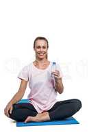 Portrait of happy sporty woman with water bottle