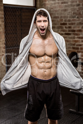 Portrait of muscular man wearing hood