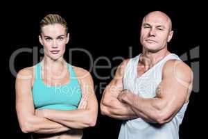 Portrait of athlete man and woman with arms crossed