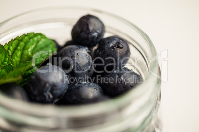 Glass jar of fresh blueberries