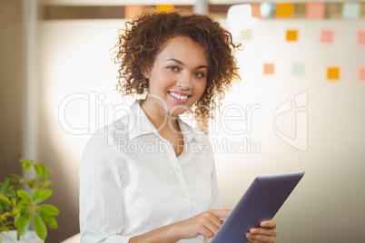 Portrait of businesswoman using digital tablet