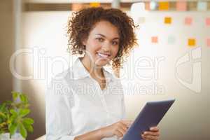 Portrait of businesswoman using digital tablet