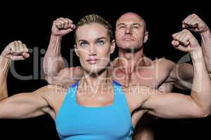 Strong muscular man and woman flexing muscles