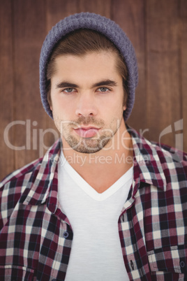 Portrait of confident man wearing knitted hat