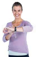 Portrait of happy young woman wearing wristwatch