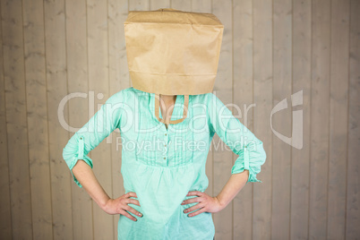 Woman covering head with brown paper bag