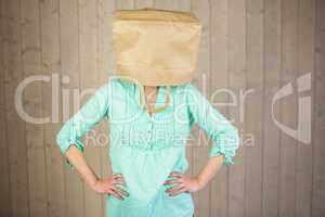 Woman covering head with brown paper bag