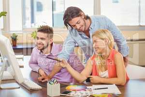 Business people at desk using computer