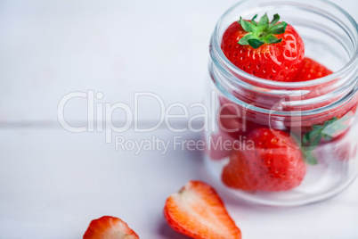 Glass jar of fresh strawberries