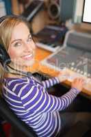 Happy young radio host in studio