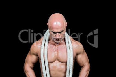 Bald man with rope around neck