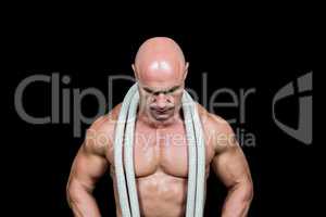 Bald man with rope around neck