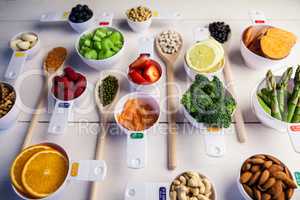Portion cups and spoons of healthy ingredients