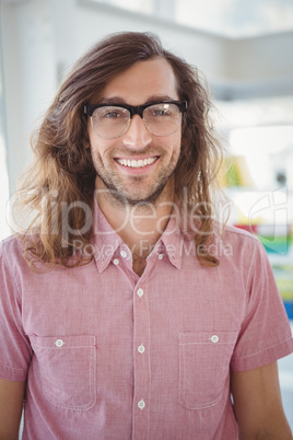 Happy man wearing eye glasses in office