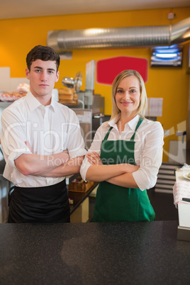 Confident coworkers in bakery