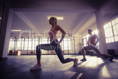 Two fit people doing fitness