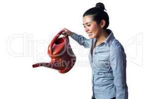 Happy woman holding a watering can