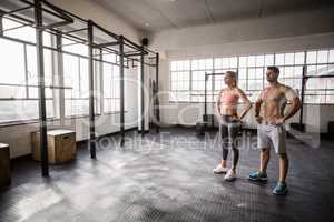 Crossfit couple posing with hands on hips