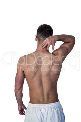 Rear view of a man suffering from neck pain