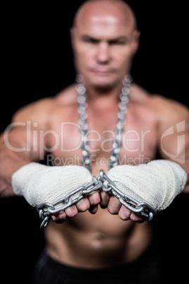 Portrait of confident man with bandage and chain