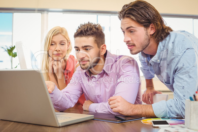 Business people focusing on laptop