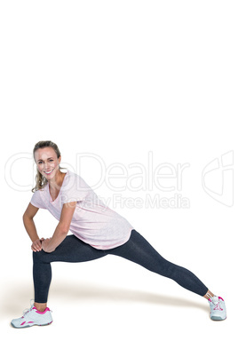 Portrait of cheerful sporty woman exercising