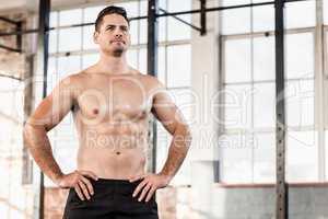 Shirtless muscular serious man posing