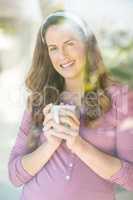 Portrait of happy woman with coffee