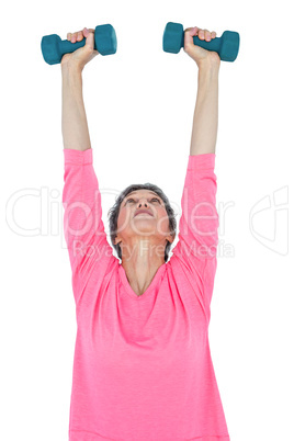 Mature woman exercising with dumbbells