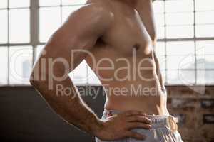 Midsection of a muscular man posing