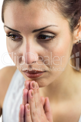 Close-up of woman with joined hands