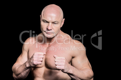 Bald man in boxing pose