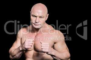 Bald man in boxing pose