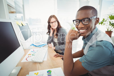 Portrait of smiling man with hand on chin