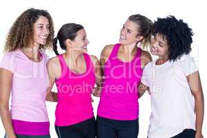 Smiling group of women with arms around