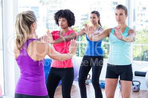 Trainer instructing women