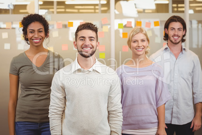 Portrait of happy colleagues in office